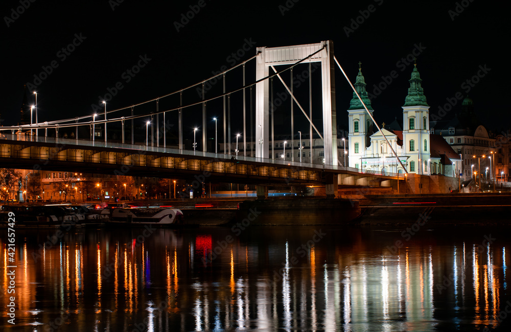 Budapest at night, Erzsebet bridge on the Danube river, reflection of night lights on the water
