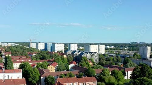 Stockholm, Sweden. Aerial Drone summer view of peaceful green suburb landscape Årsta with high-rise buildings and blue sky.