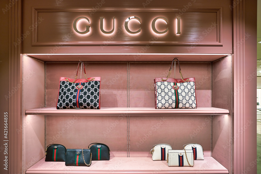 BERLIN, GERMANY - CIRCA SEPTEMBER, 2019: Gucci bags on display at the Kaufhaus des Westens (KaDeWe) department store in Berlin. Stock Photo Adobe Stock