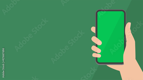 スマートフォンのモックアップ素材：スマホを持つ人の手とコピースペースのある画面（緑）