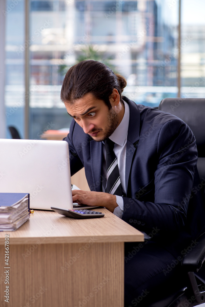 Young businessman employee working in the office