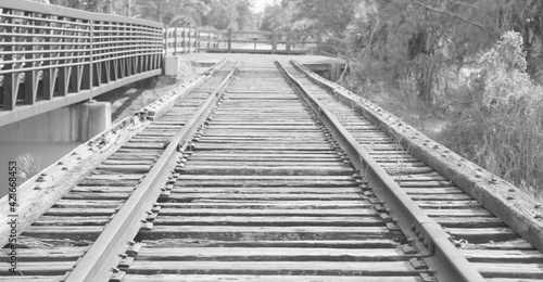 Black and white photo of old rail road tracks.