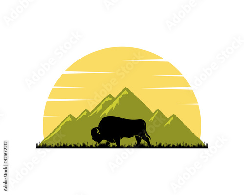 Green mountain and bison inside