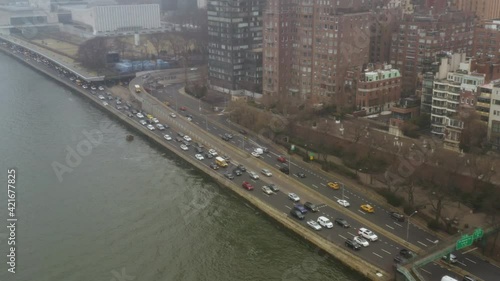 4K Aerial NYC traffic on the FDR drive overlooking east river on rainy day