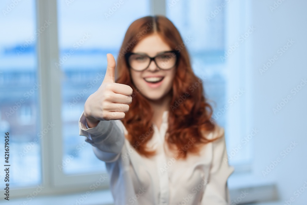 Fototapeta premium pretty red-haired woman in shirt office tin plate with hands Copy Space