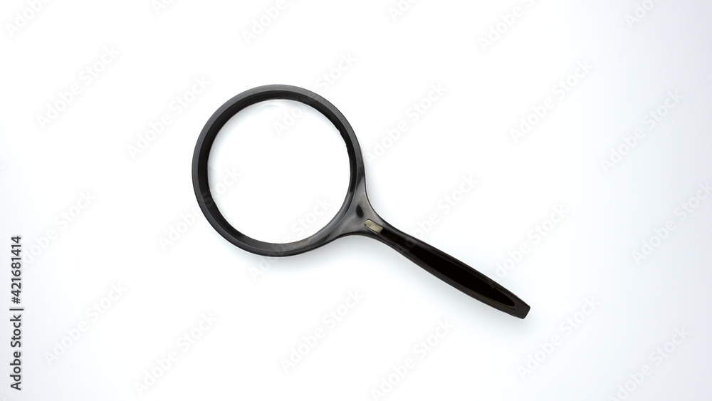 Black magnifying glass isolated in white background.
Black magnifying glass isolated in white background.