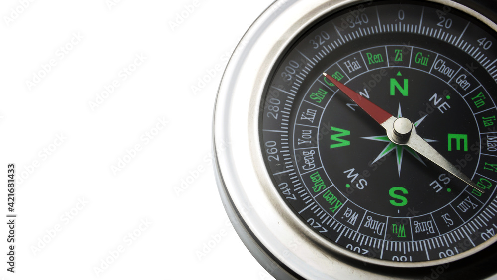 Close up silver compass isolated in white background.
Close up silver compass isolated in white background.