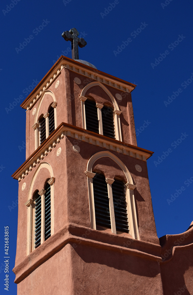 looking up at the bell tower of the oldest church in the united states, built in 1615, san miguel catholic church on a sunny fall day in socorro, new mexico