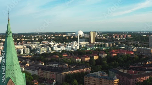 Wallpaper Mural Stockholm, Sweden. Panoramic aerial flying drone view of Södermalm, Sofia church tower, globe, park, and city. Torontodigital.ca