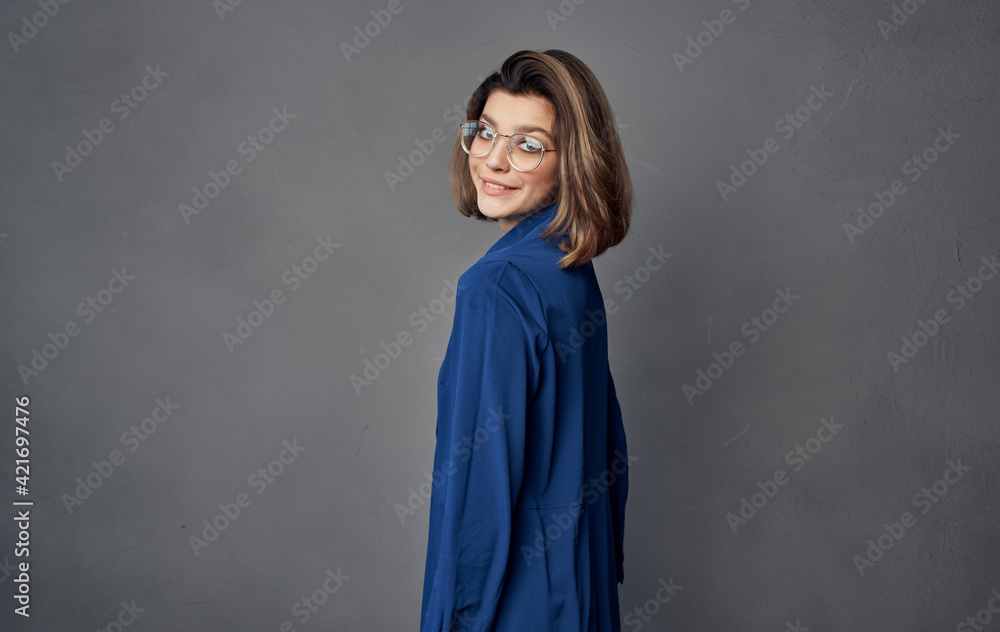 cheerful pretty woman with glasses blue shirt fashion gray background cheerful pretty woman with glasses blue shirt fashion gray background