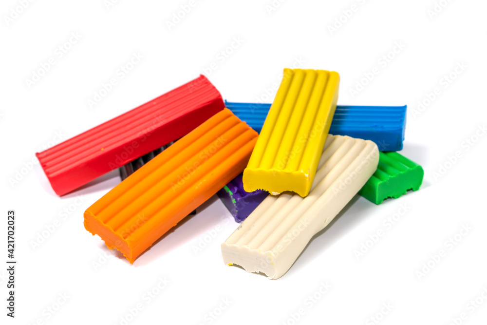 Composition of colored plasticine on isolated white background. colorful molding dough. polymer clay Composition of colored plasticine on isolated white background. colorful molding dough. polymer clay