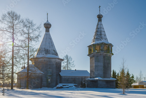 Old wooden church of the Epiphany on February afternoon. Pogost (Oshevenskoe). Arkhangelsk region, Russia