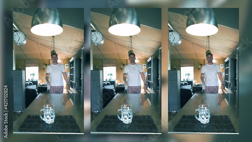 Challenge is popular on social networks, a young guy throws a water bottle from a distance and gets it into a beer glass, a meme in the kitchen a guy does a trick. Vertical video