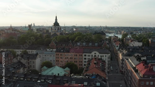Stockholm, Sweden. Panoramic aerial flying drone rooftop view of Södermalm, the city, buildings with Katarina kyrka in background.