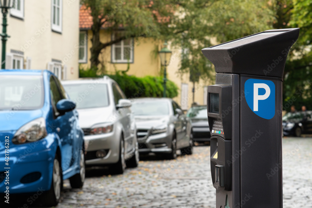 Fototapeta premium Parking machine with solar panel in the city street. Pay On Foot Parking System 