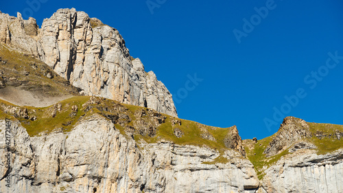 Obraz na plátně Low Angle View Of Rocks Against Blue Sky