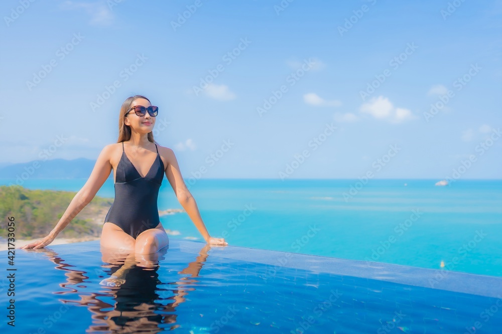 Portrait beautiful young asian woman relax smile leisure around outdoor swimming pool Portrait beautiful young asian woman relax smile leisure around outdoor swimming pool