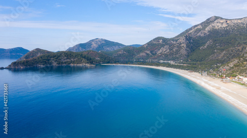 A fascinating view that has the unique nature of Oludeniz which is a county of Fethiye in Turkey. Because of its warm climate and fresh air, it has been an important destination to visit for tourists. © photograzon