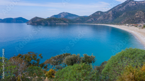 Panoramic and vivid shot of Oludeniz  also known as Blue Lagoon  in Fethiye. It is located on south-west of Turkey and it has been a tourist attraction with its blue sea  weather and coast.