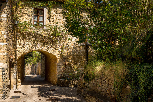 Fototapeta Naklejka Na Ścianę i Meble -  walk in a small street of the medieval village of Saint Montan, Archèche
