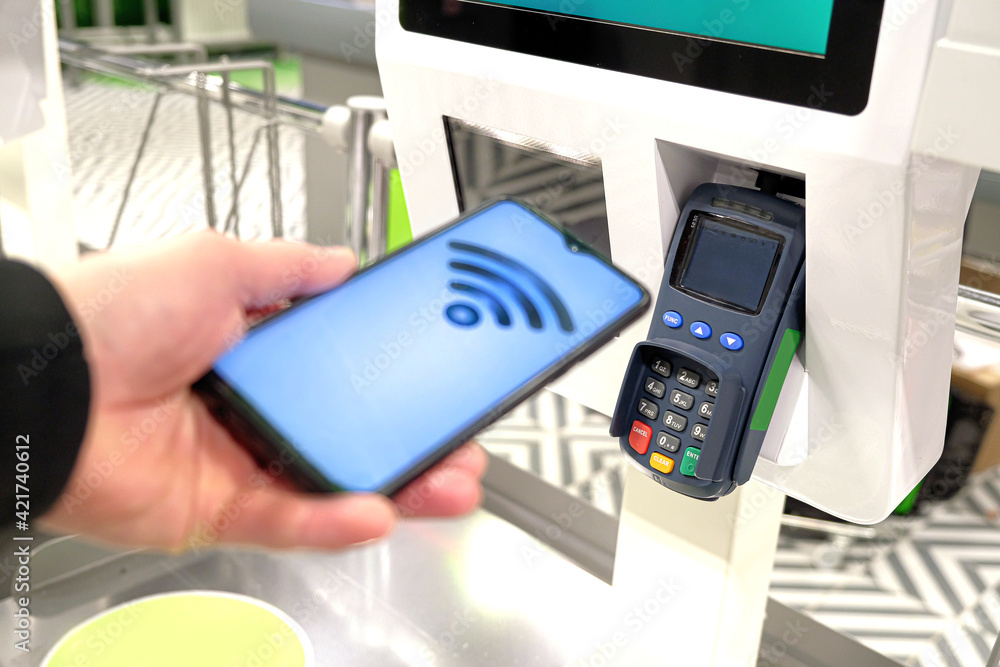 Payment by card, in the payment terminal. Electronic money. Mobile banking. Shopping complex. Payment by card, in the payment terminal. Electronic money. Mobile banking. Shopping complex.