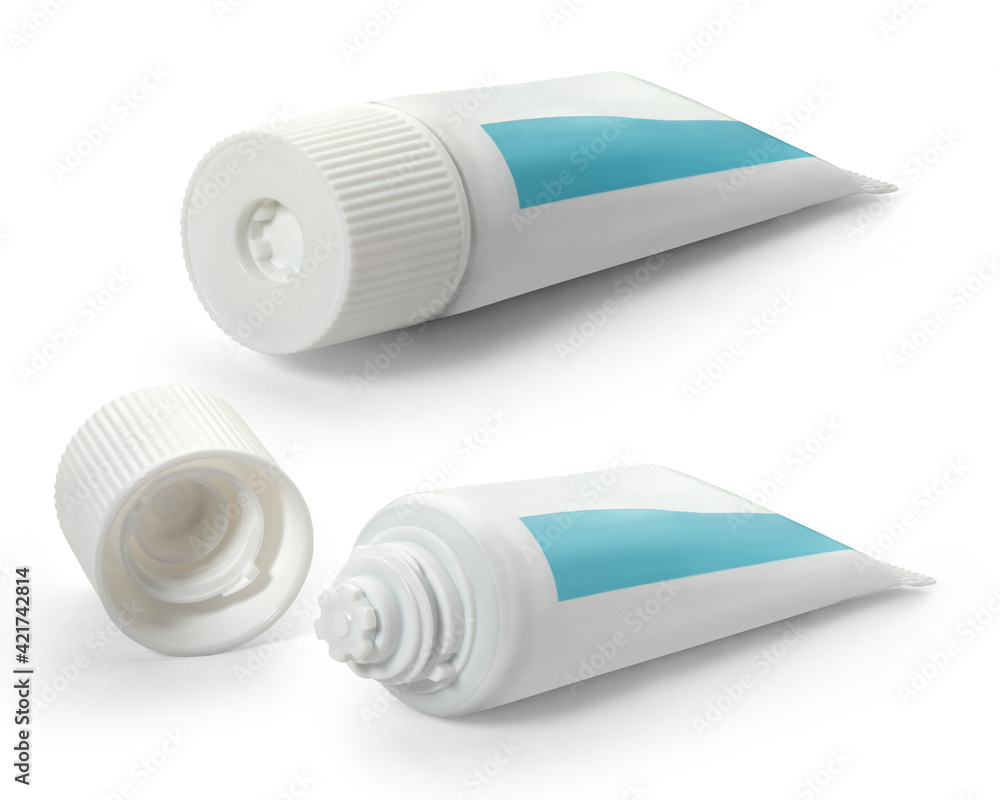 Two white tubes of toothpaste with turquoise on a white background. Full depth of field. With clipping path. Two white tubes of toothpaste with turquoise on a white background. Full depth of field. With clipping path.