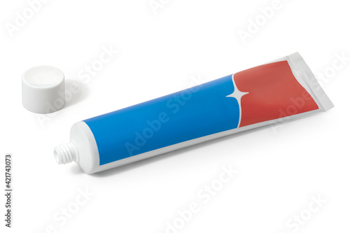 A tube of red and blue toothpaste on a white background. Full depth of field. With clipping path.