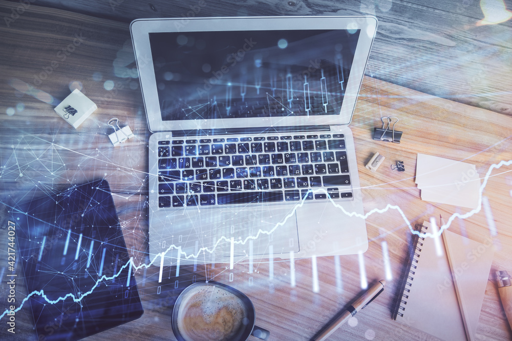 Double exposure of financial chart drawing over table background with computer. Concept of research and analysis. Top view. Double exposure of financial chart drawing over table background with computer. Concept of research and analysis. Top view.