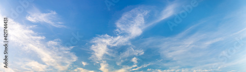 Panorama or panoramic photo of blue sky and white clouds or cloudscape. for breathing concepts background.