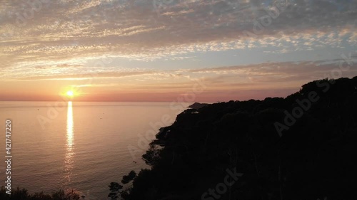 Aerial shot by drone of the sunset by the sea on the French Riviera. sanary, var, France