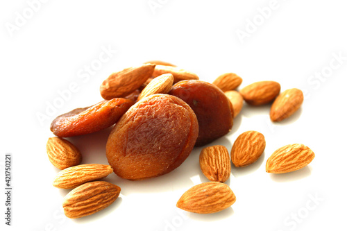 Nuts and dried fruits, almond and apricots natural, white background