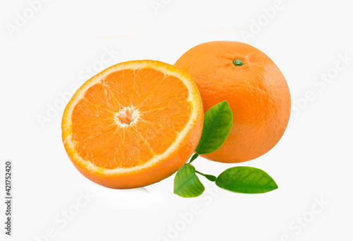 Orange fruit with orange slices and leaves isolated on white background.