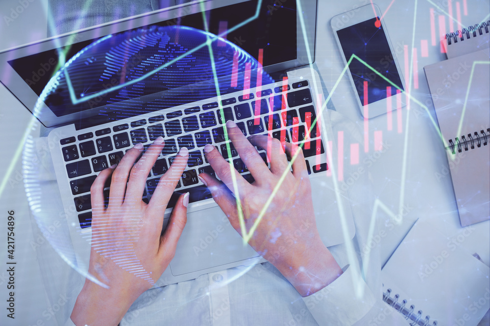 Double exposure of woman hands working on computer and forex chart hologram drawing. Top View. Financial analysis concept. Double exposure of woman hands working on computer and forex chart hologram drawing. Top View. Financial analysis concept.