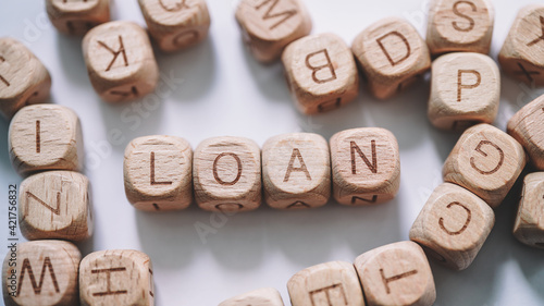 Loan word concept. Wooden Blocks close up view 