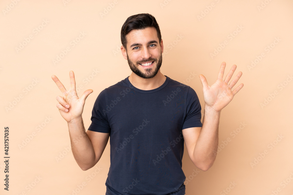 Caucasian handsome man isolated on beige background counting eight with fingers Caucasian handsome man isolated on beige background counting eight with fingers