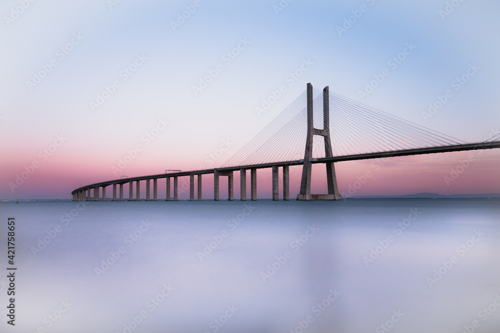 Vasco da Gama bridge at sunset. Lisbon bridge at sunset