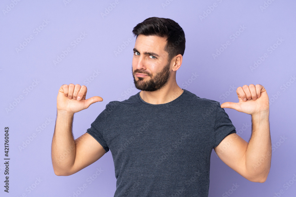 Caucasian handsome man proud and self-satisfied over isolated purple background Caucasian handsome man proud and self-satisfied over isolated purple background