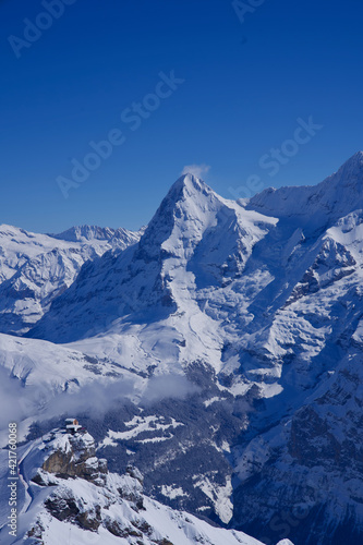 Panorama of Bernese Alps with Mountain Peak Eiger  seen from M  rren  Switzerland.