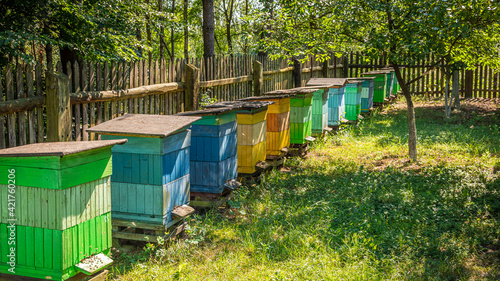 Handmade beehives in countryside. Ecological and natural beekeeping.