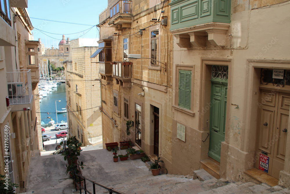 stairs and stone residential buildings in senglea in malta 