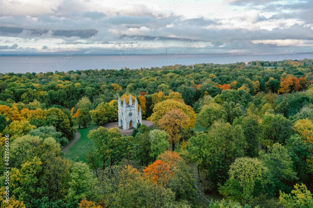 Panoramic aerial view of the Church in the medieval Gothic style in the park of St. Petersburg. Gothic chapel. Autumn.