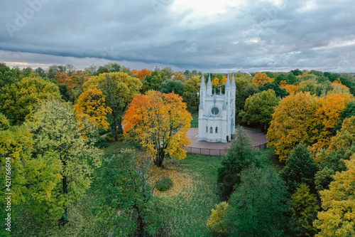 Panoramic aerial view of the Church in the medieval Gothic style in the park of St. Petersburg. Gothic chapel. Autumn.