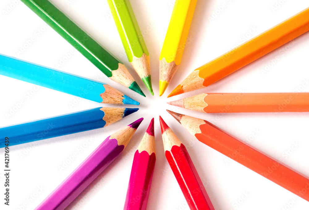 White background with colored pencils. Rounded frame White background with colored pencils. Rounded frame