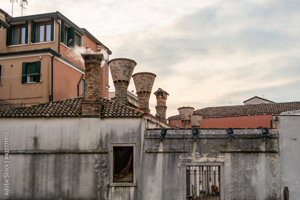 View of particular chimneys in the city of Chioggia, Veneto - Italy