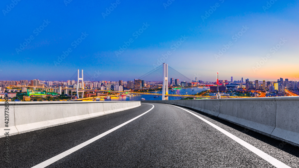 Asphalt highway and city skyline with bridge at night in Shanghai,China. Asphalt highway and city skyline with bridge at night in Shanghai,China.