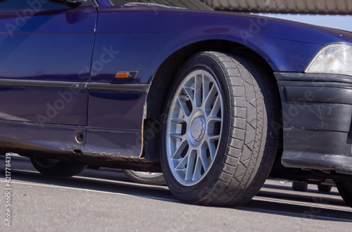 car on the road  car wheel on the road  close up of a sports car wheel