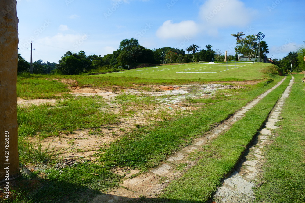 Football pitch at an angle with an extreme gradient, on a slope near the federal road between Manaus and the village Presidente Figueiredo, Amazon state, Brazil.