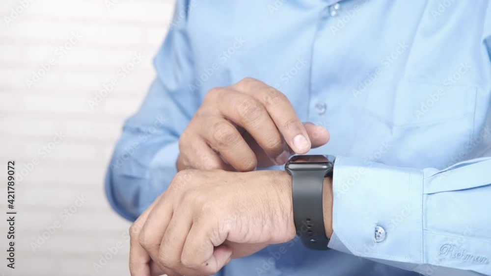 man's hand using smart watch. man's hand using smart watch.