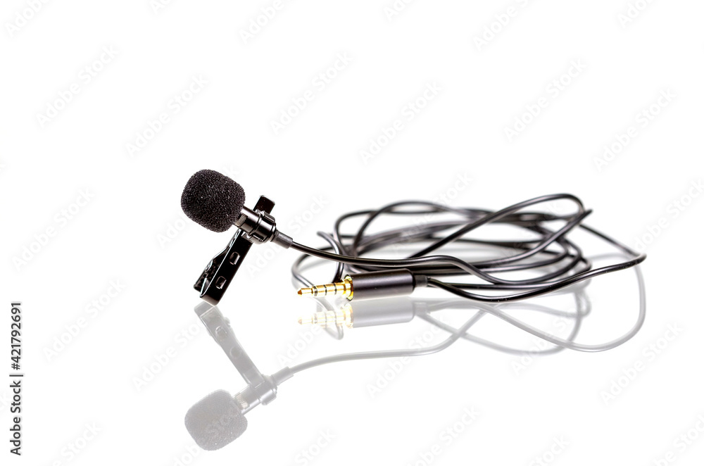 Small lavalier microphone or lapel mic with clip on white background. Small lavalier microphone or lapel mic with clip on white background.