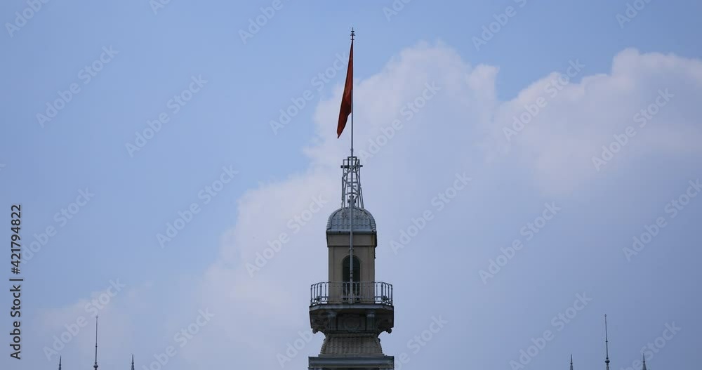 A vietnamese flag behind the blue sky long shot A vietnamese flag behind the blue sky long shot